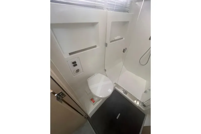 Slide: The Image of Modern bathroom in 2026 Jeanneau TH38 yacht with shower and toilet. - 57