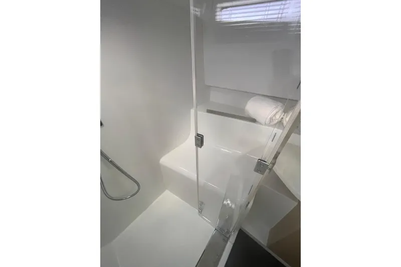 Slide: The Image of Modern bathroom in 2026 Jeanneau TH38 yacht with glass shower enclosure. - 58