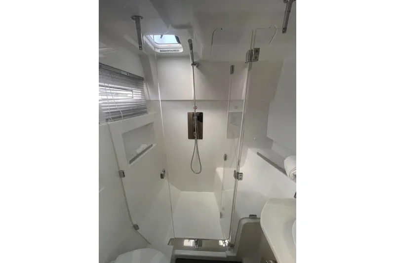 Slide: The Image of Modern bathroom in 2026 Jeanneau TH38 yacht with glass shower and sleek design. - 59