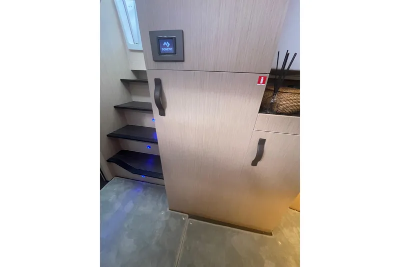 Slide: The Image of Interior of 2026 Jeanneau TH38 yacht with modern stairs and cabinetry. - 64