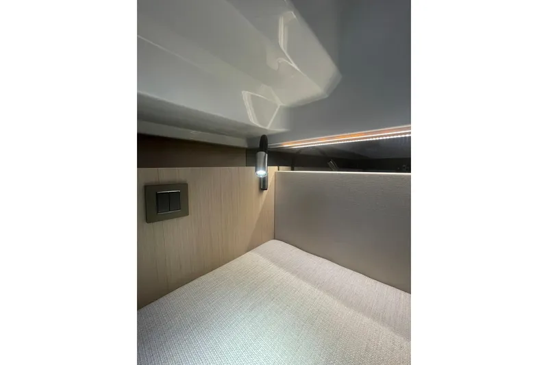 Slide: The Image of Interior cabin of 2026 Jeanneau TH38 yacht with modern lighting and sleek design. - 67