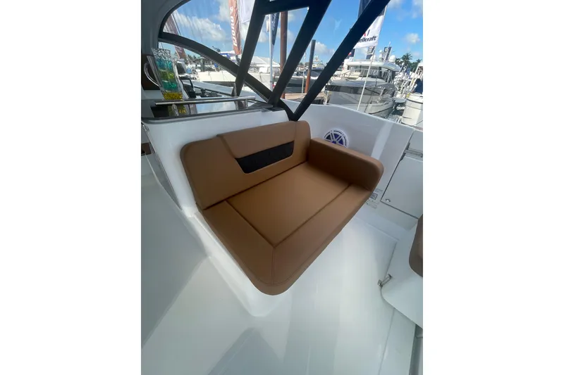 Slide: The Image of 2026 Jeanneau TH38 boat interior with brown cushioned seating and modern design. - 72