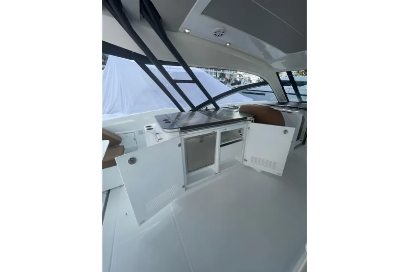 Slide: The Image of Interior view of 2026 Jeanneau TH38 yacht with open storage compartments. - 83