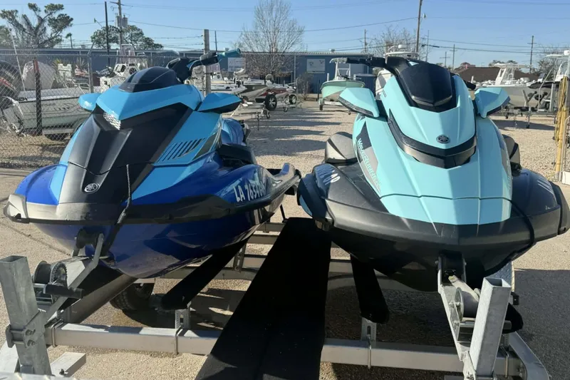 Slide: The Image of 2023 Yamaha WaveRunner GP1800R SVHO jet skis on trailers, blue and teal models. - 10
