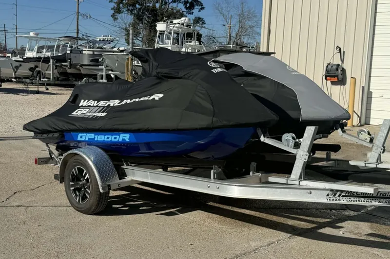 Slide: The Image of 2023 Yamaha WaveRunner GP1800R SVHO on trailer, covered, parked outdoors. - 3