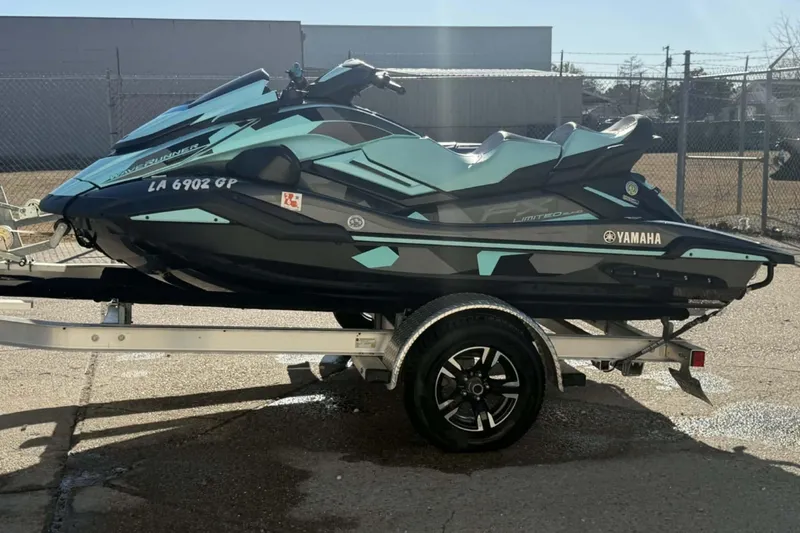 Slide: The Image of 2023 Yamaha WaveRunner GP1800R SVHO on trailer, sleek design, parked outdoors. - 8