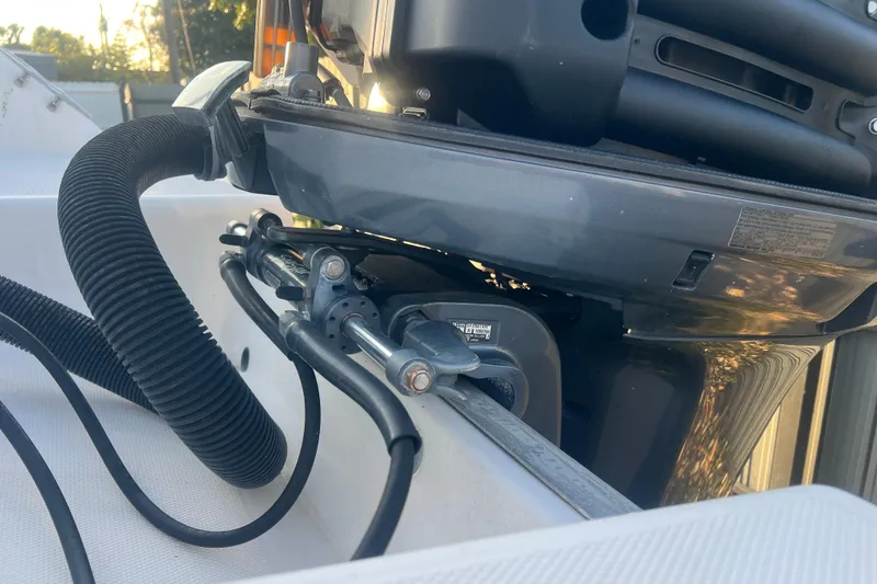 Slide: The Image of 2011 Wellcraft 232 Coastal boat engine detail with cables and hoses. - 12