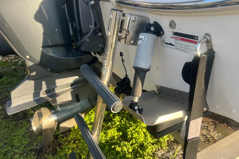 Slide: The Image of 2011 Wellcraft 232 Coastal boat engine and ladder detail. - 13