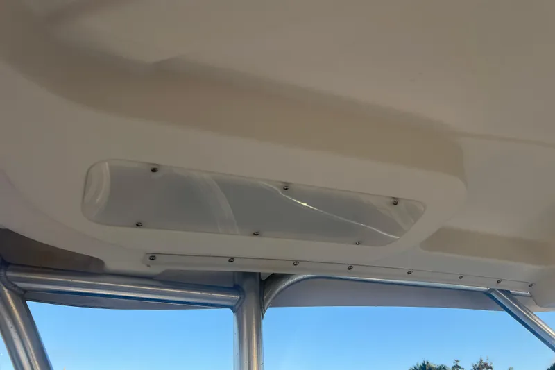Slide: The Image of 2011 Wellcraft 232 Coastal boat interior ceiling with metal frame and skylight. - 21