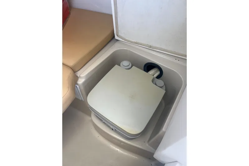Slide: The Image of Portable toilet in 2011 Wellcraft 232 Coastal boat interior. - 25