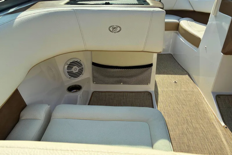 Slide: The Image of 2020 Cobalt 200S boat interior with beige seating and speaker system. - 14