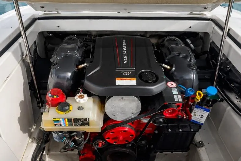 Slide: The Image of Engine compartment of a 2020 Cobalt 200S boat, featuring a Volvo Penta engine. - 19