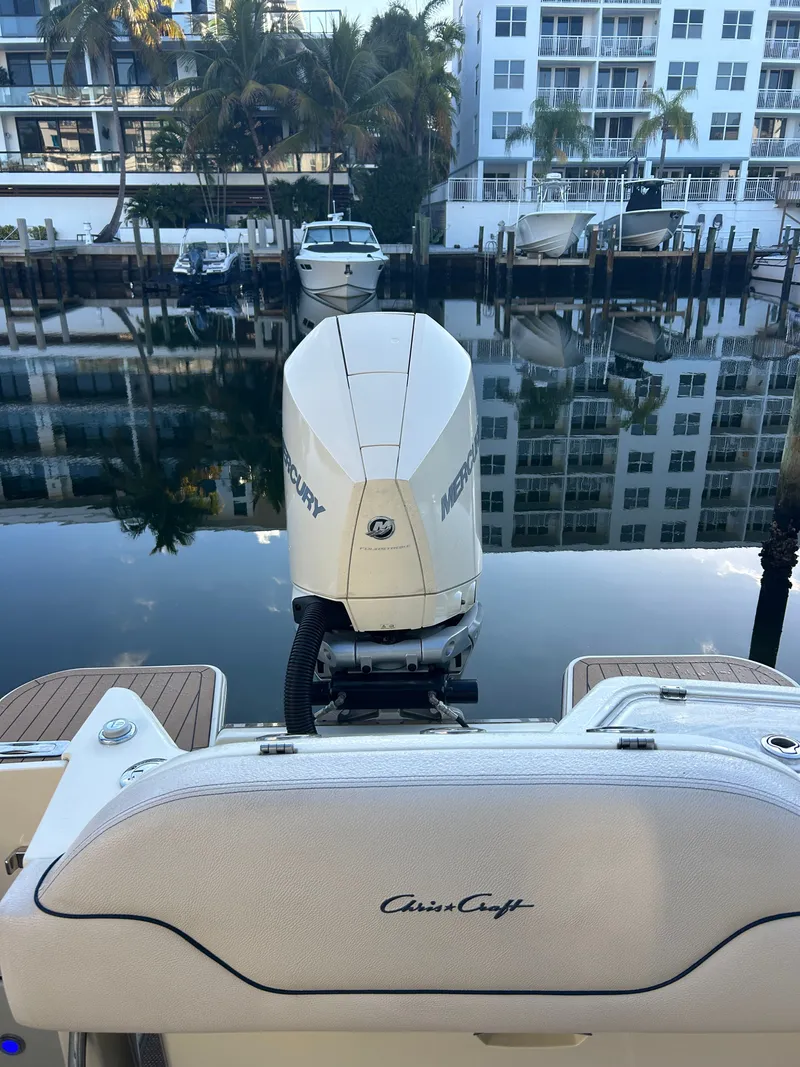 Slide: The Image of Chris-Craft Calypso 2022 boat at dock with Mercury engine. - 14