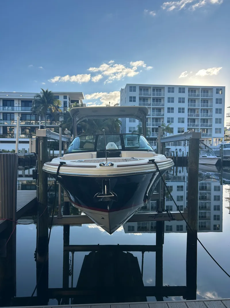 Slide: The Image of Chris-Craft Calypso 2022 boat docked at marina during sunset. - 3