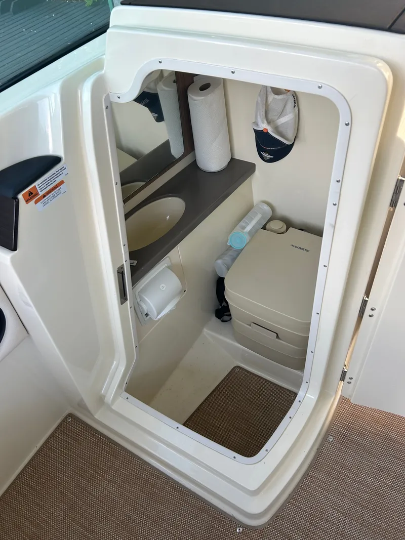 Slide: The Image of Interior of 2022 Chris-Craft Calypso with toilet and sink. - 7