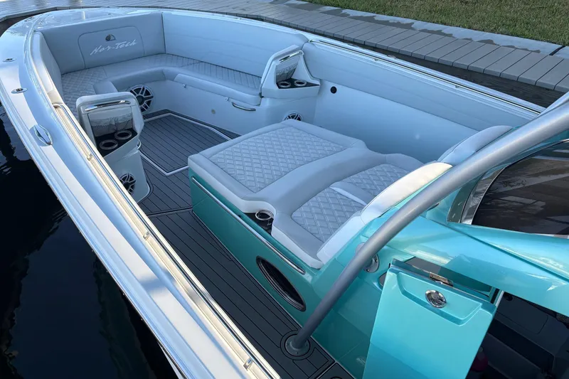 Slide: The Image of 2024 Nor-Tech 390 Sport Center Console with luxurious seating and sleek design. - 12