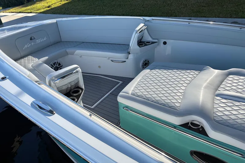 Slide: The Image of 2024 Nor-Tech 390 Sport Center Console with luxurious seating and modern design. - 13