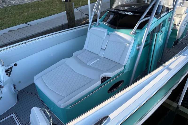 Slide: The Image of 2024 Nor-Tech 390 Sport Center Console with luxurious seating and sleek design. - 14