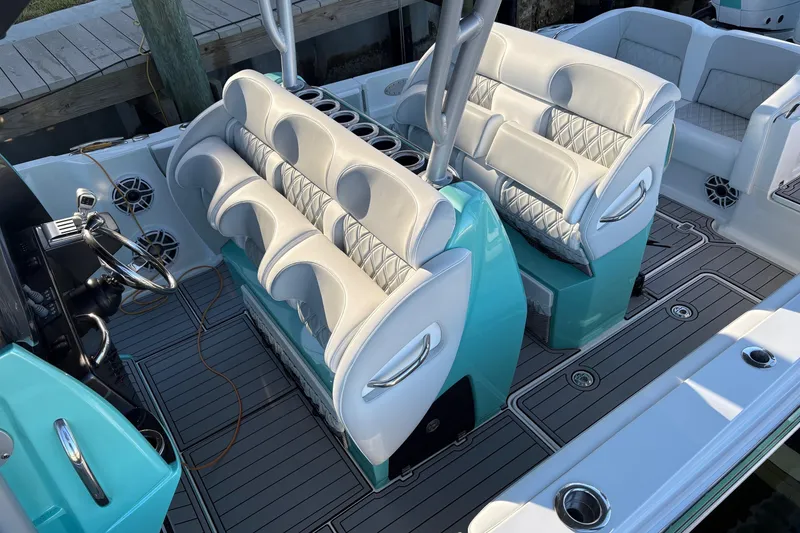 Slide: The Image of 2024 Nor-Tech 390 Sport Center Console with luxurious seating and modern design. - 16