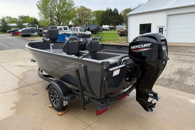 Slide: The Image of 2026 Lund 1650 Rebel XL SS boat with Mercury 60 engine on trailer. - 4