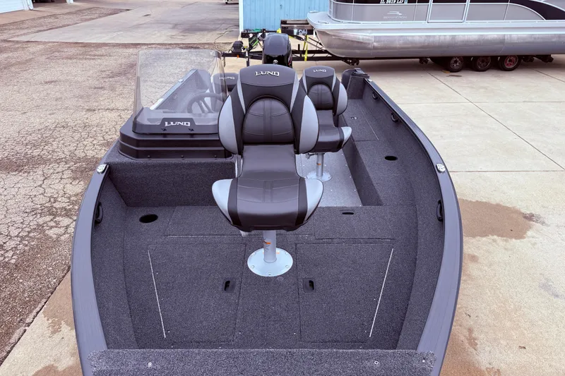 Slide: The Image of 2026 Lund 1650 Rebel XL SS fishing boat with sleek seating and spacious deck. - 6