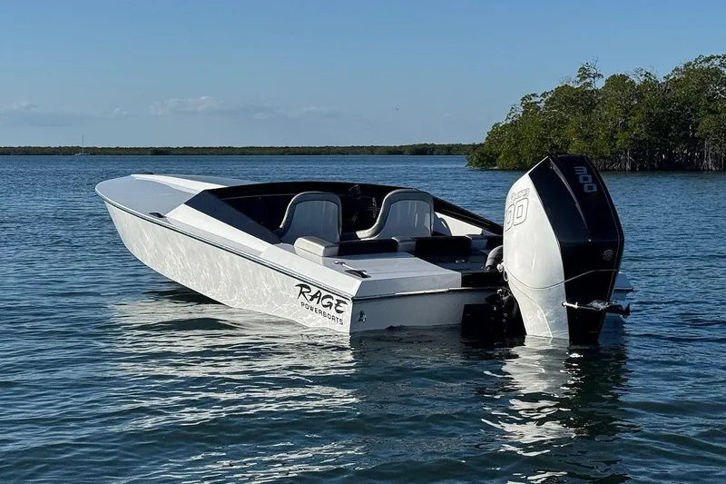 Slide: The Image of 1988 Activator 22 boat with powerful outboard motor on calm water. - 4