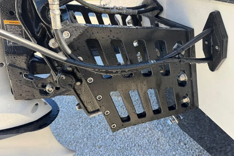 Slide: The Image of Close-up of a 1988 Activator 22 boat engine mount with cables and bolts. - 7