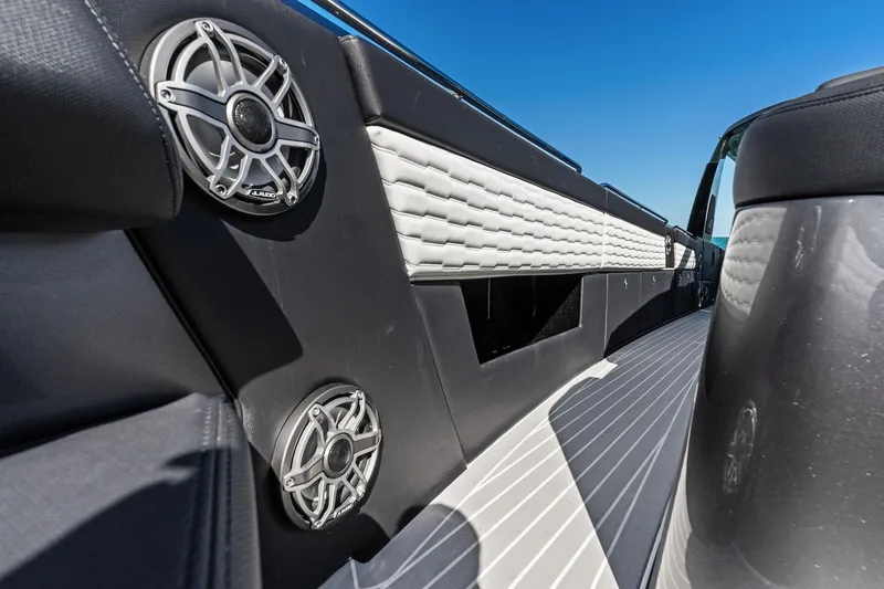 Slide: The Image of 2020 Cigarette 42' Auroris boat interior with speakers and sleek design. - 17
