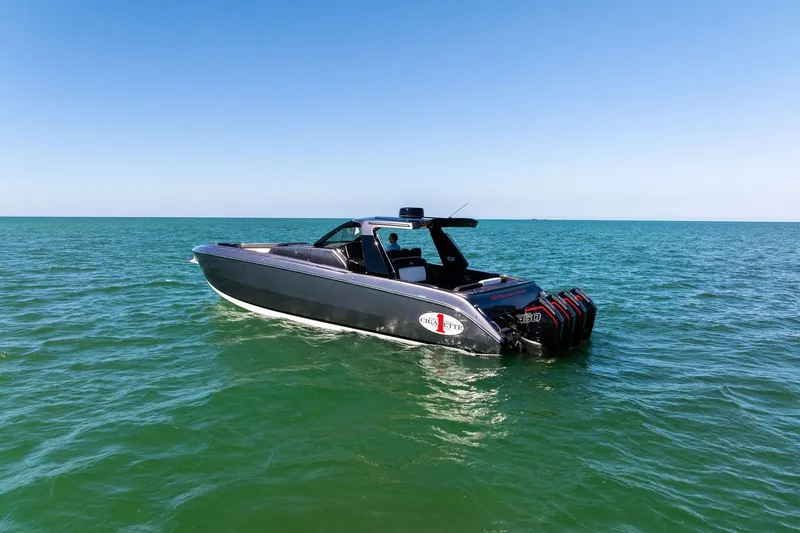 Slide: The Image of 2020 Cigarette 42' Auroris boat on open sea under clear blue sky. - 2