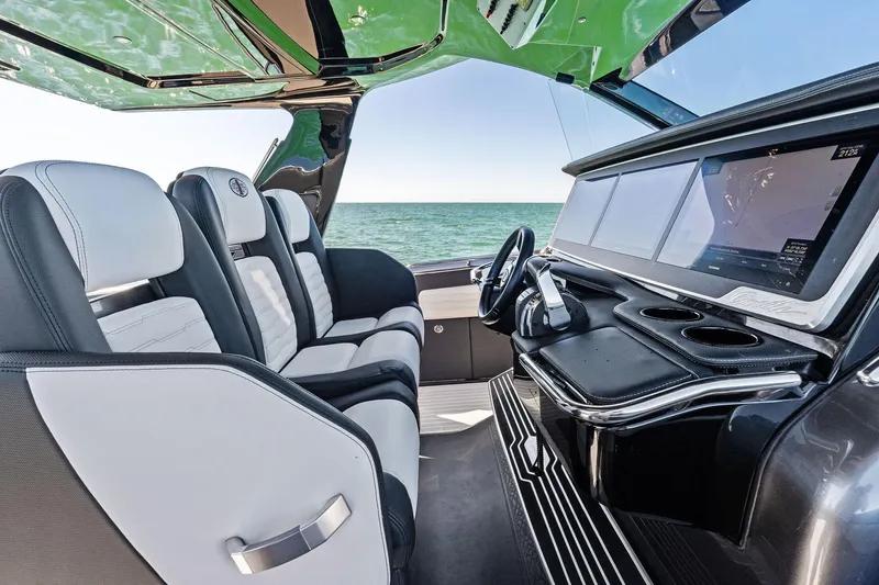 Slide: The Image of Luxurious interior of 2020 Cigarette 42' Auroris boat with modern dashboard and seating. - 25