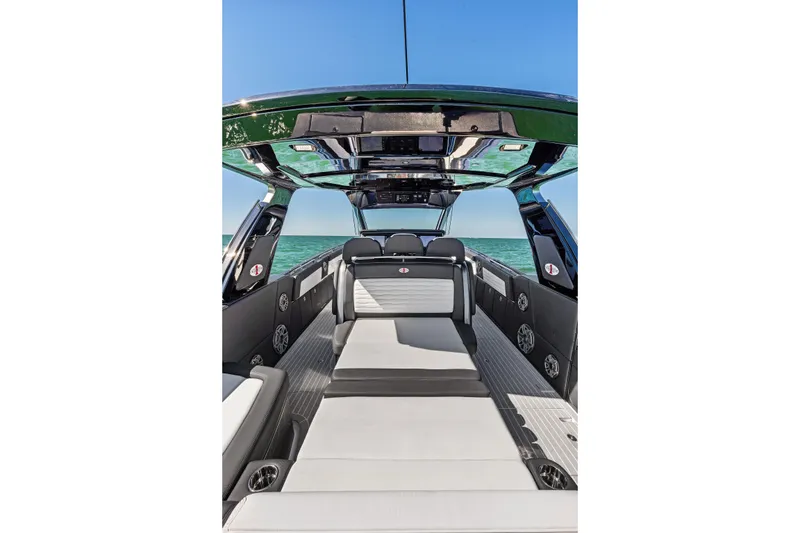 Slide: The Image of 2020 Cigarette 42' Auroris luxury boat interior with sleek seating and ocean view. - 33