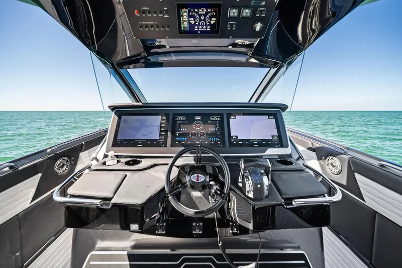 Slide: The Image of Cockpit of 2020 Cigarette 42' Auroris boat with advanced navigation systems on open sea. - 37