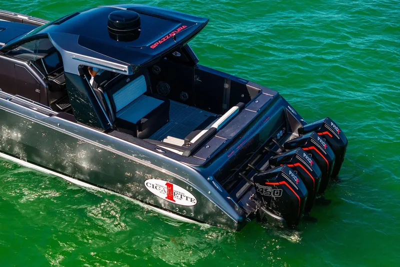 Slide: The Image of 2020 Cigarette 42' Auroris boat with powerful outboard engines on green water. - 4