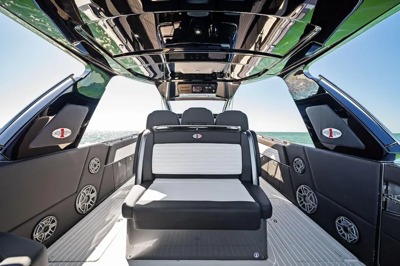 Slide: The Image of 2020 Cigarette 42' Auroris luxury boat interior with sleek seating and ocean view. - 40