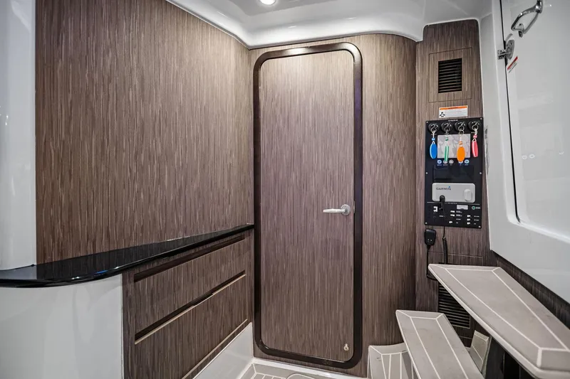 Slide: The Image of Interior of 2020 Cigarette 42' Auroris boat with wood paneling and control panel. - 43