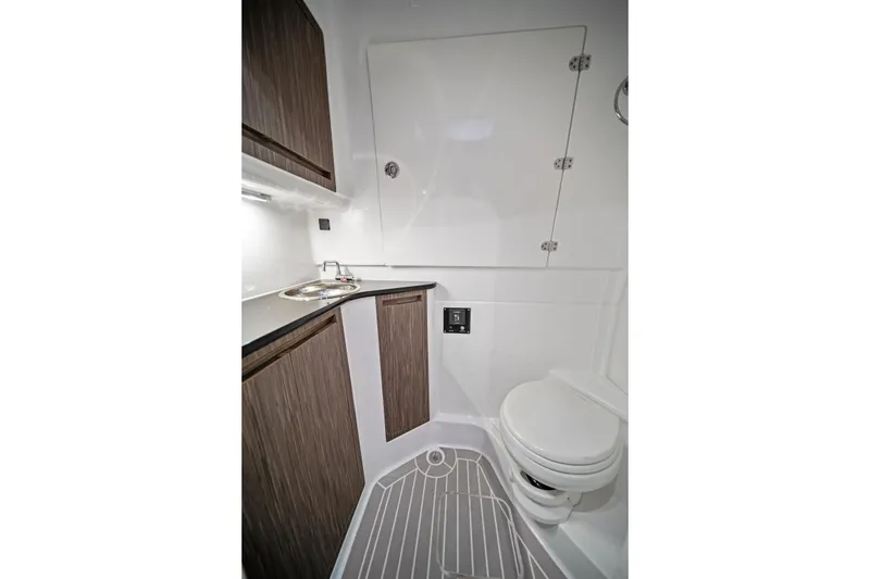 Slide: The Image of 2020 Cigarette 42' Auroris boat bathroom with modern sink and toilet design. - 44