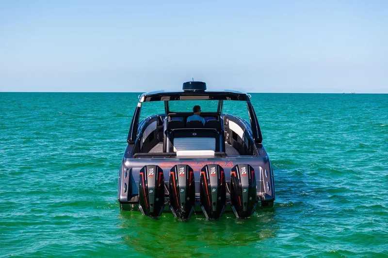 Slide: The Image of 2020 Cigarette 42' Auroris boat with multiple engines on turquoise water. - 5