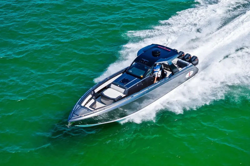 Slide: The Image of 2020 Cigarette 42' Auroris speedboat cruising on vibrant green water. - 6