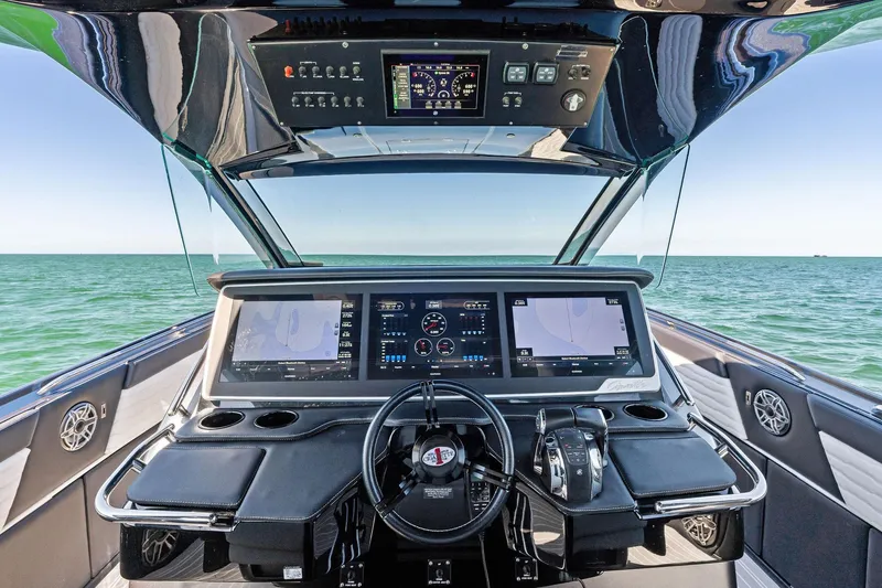 Slide: The Image of Cockpit view of 2020 Cigarette 42' Auroris yacht with advanced navigation displays. - 8
