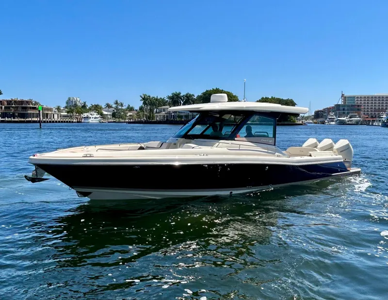 Slide: The Image of 2023 Chris-Craft 35 CALYPSO boat cruising on a sunny day. - 2