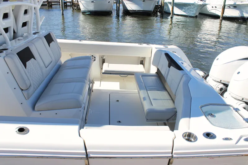 Slide: The Image of 2024 Sailfish 360 CC boat interior with luxurious seating and modern design. - 18