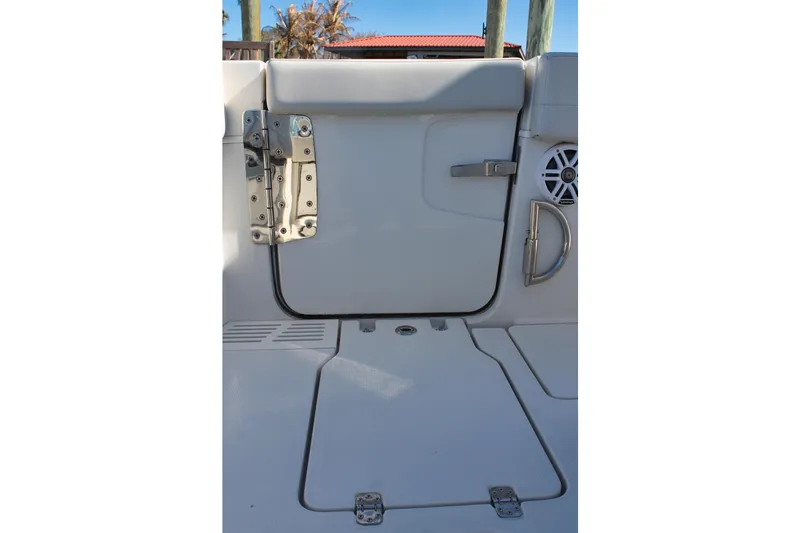 Slide: The Image of 2024 Sailfish 360 CC boat interior with hatch and speaker detail. - 20