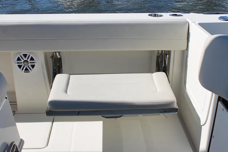 Slide: The Image of 2024 Sailfish 360 CC boat with foldable seat and speaker on deck. - 22