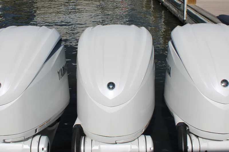 Slide: The Image of Triple Yamaha outboard engines on a 2024 Sailfish 360 CC boat at the dock. - 28