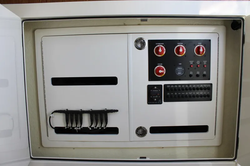 Slide: The Image of Electrical control panel on 2024 Sailfish 360 CC boat, featuring switches and wiring. - 29