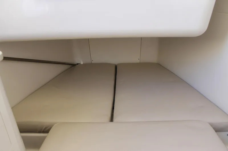 Slide: The Image of 2024 Sailfish 360 CC cabin interior with beige cushions. - 33