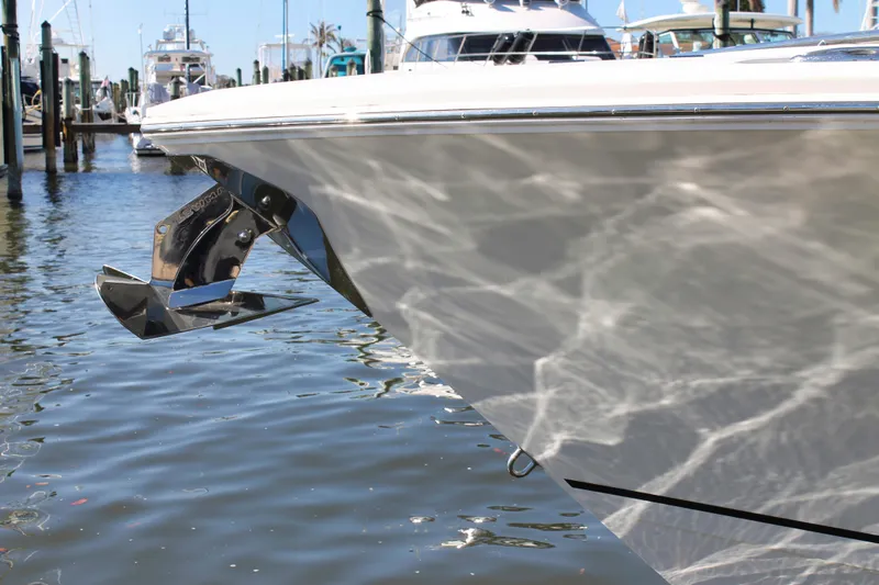 Slide: The Image of 2024 Sailfish 360 CC boat with anchor, docked in marina. - 38