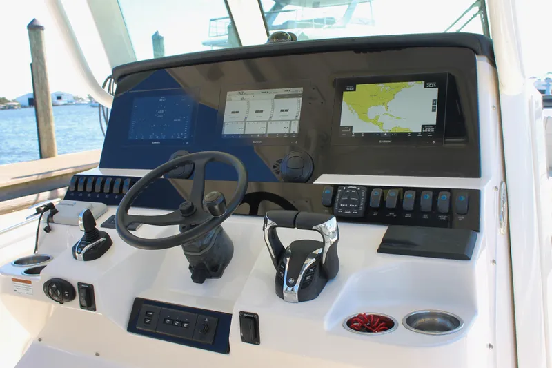 Slide: The Image of 2024 Sailfish 360 CC boat dashboard with advanced navigation and control systems. - 9