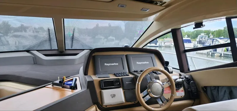 Slide: The Image of Interior view of 2013 Azimut 45 Flybridge yacht cockpit with modern navigation equipment. - 11