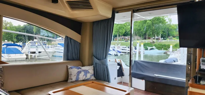 Slide: The Image of Interior view of 2013 Azimut 45 Flybridge yacht, overlooking marina with boats. - 15